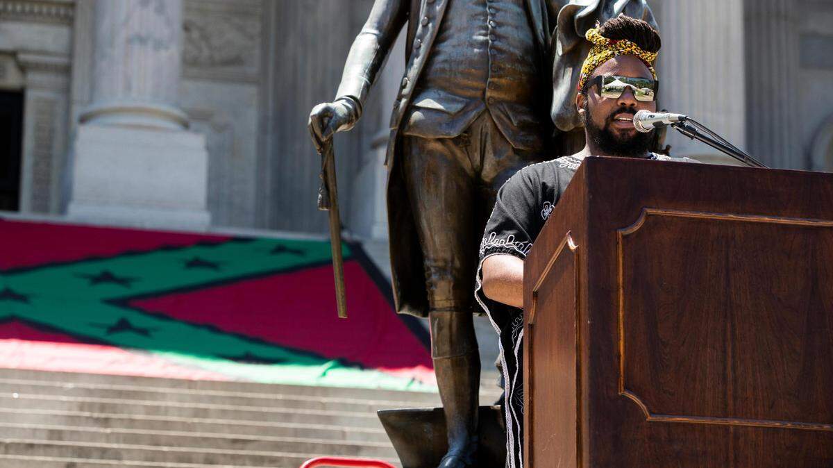Terrance Henderson welcomes people to a rally and memorial for the Emmanuel Nine titled The Confederate State of Mind at the South Carolina State House on Thursday, June 17, 2021. The rally featured artists and activists sharing mourning for the victims of the mass shooting six years ago and reflections on the ideology behind white supremacist violence.