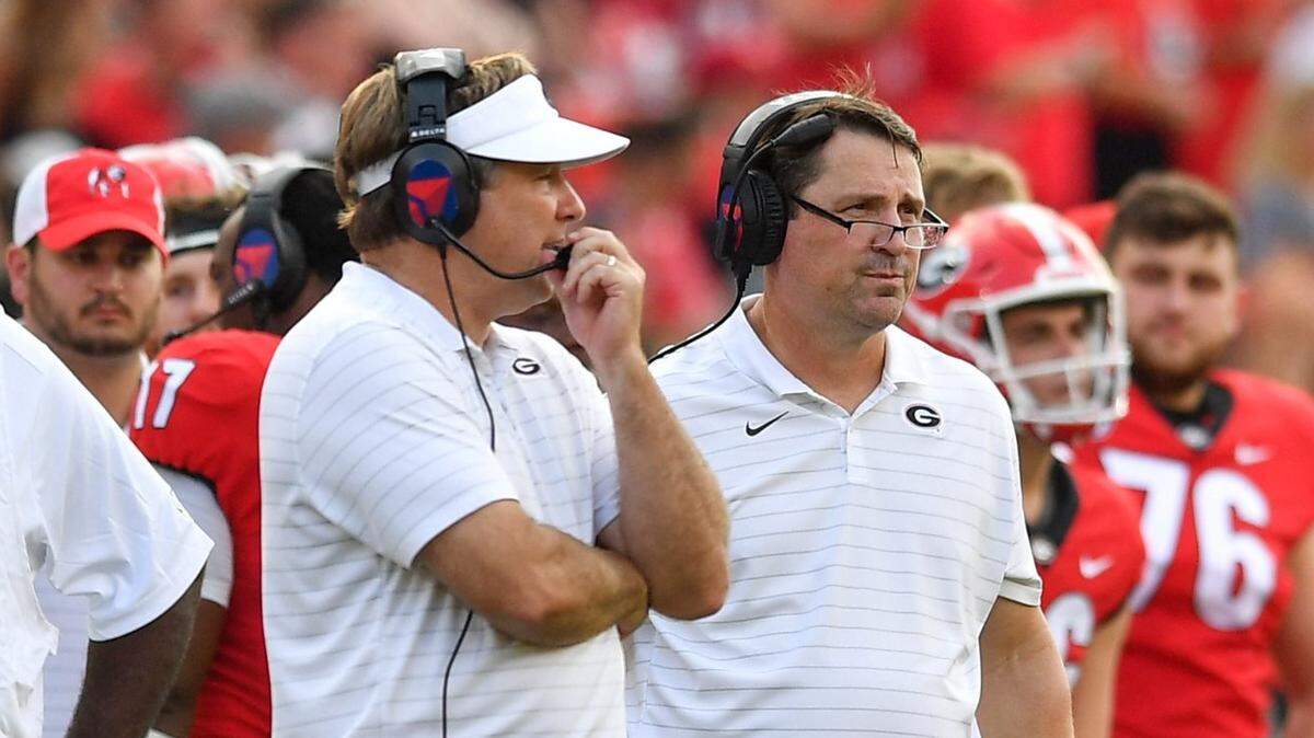Kirby Smart and Will Muschamp during Saturday’s game against UAB.