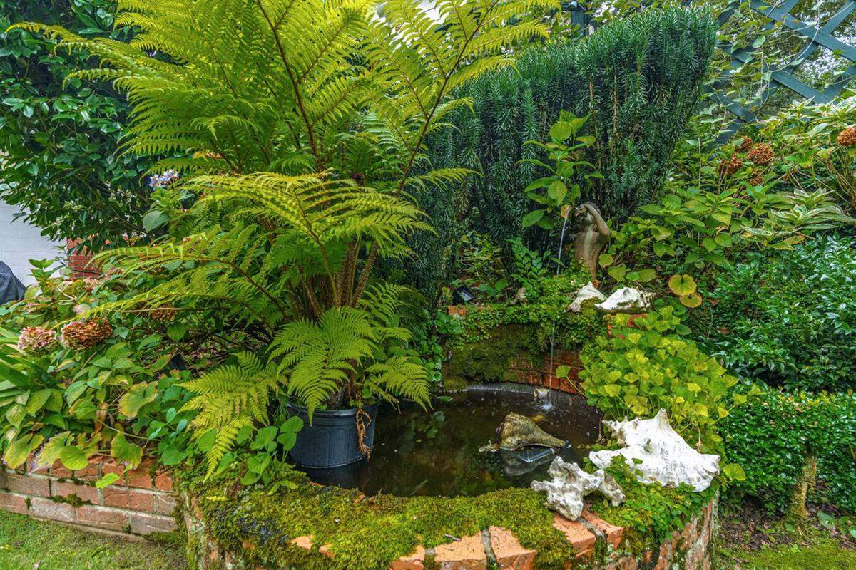 A fountain behind the Camden home.