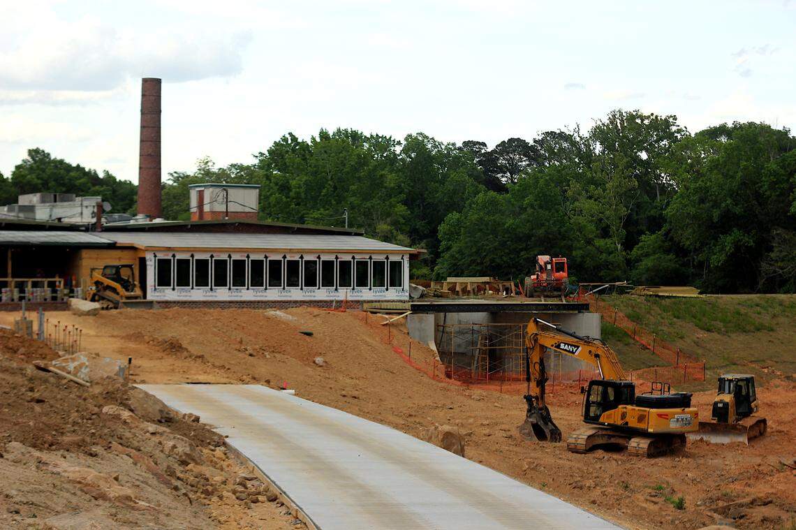 Work on the Old Mill Brewpub’s replacement deck and the trail around the Old Mill Pond take shape May 3, 2024.