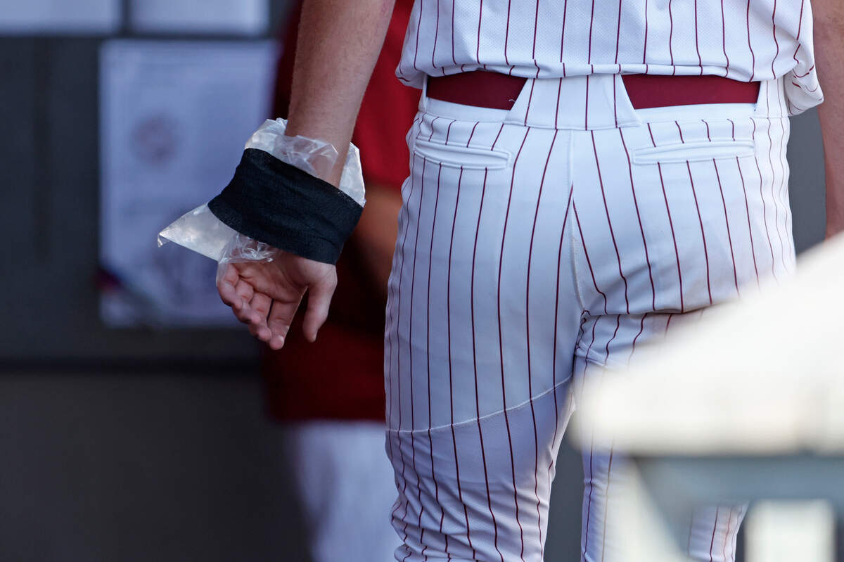 South Carolina’s Ethan Petry (20) has his hand in ice after being hit by a pitch against James Madison during an NCAA college regional baseball game in Raleigh, N.C., Friday, May 31, 2024.