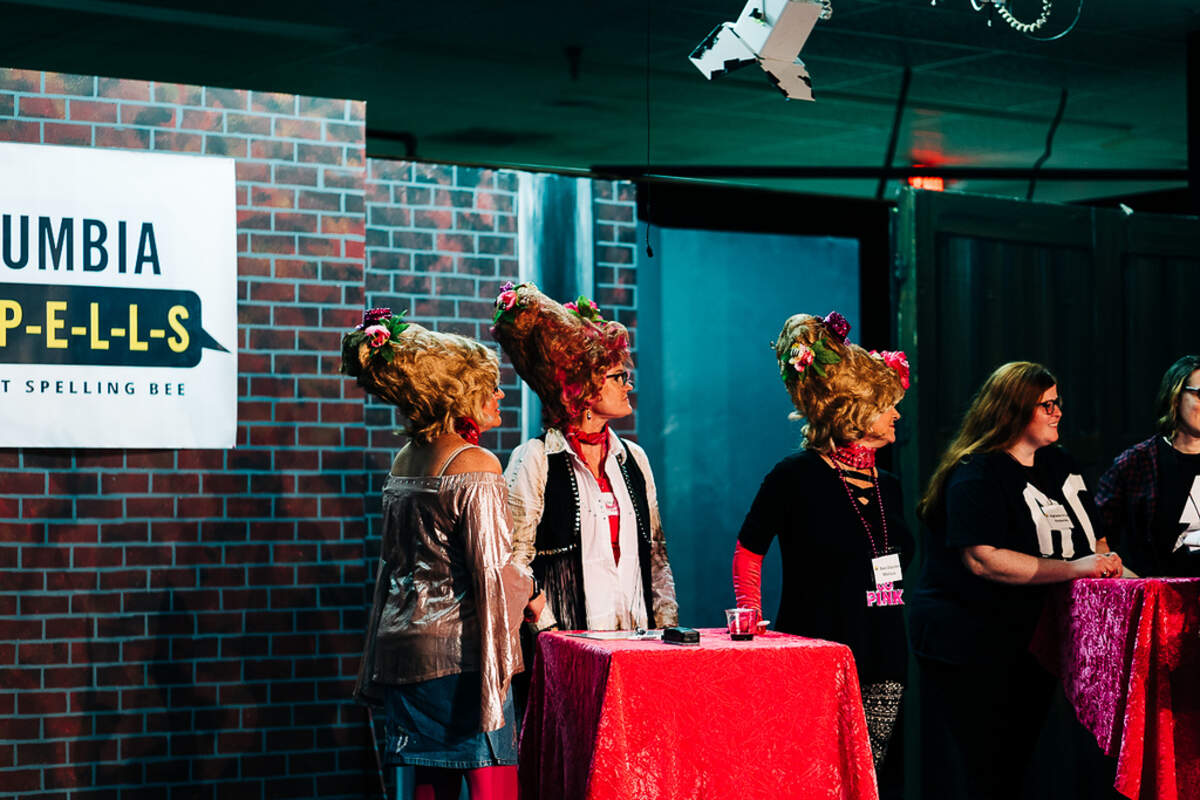 A team competes in a previous previous Columbia S-P-E-L-L-S Adult Spelling Bee.