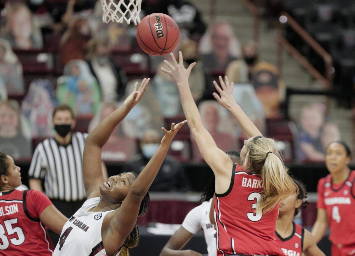 South Carolina Gamecocks forward Aliyah Boston (4) tries to recover the ball as Georgia Lady Bulldogs guard Sarah Ashlee Barker (3) shoots at Colonial Life Arena on Thursday, January 21, 2021.