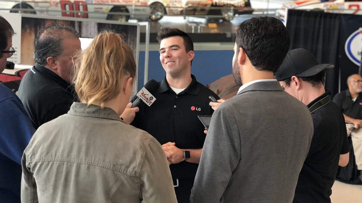 Bluffton native Gus Dean talks with reporters Wednesday at the NASCAR Hall of Fame in Charlotte, N.C. Dean was named as the driver of the No. 12 truck for Young Motorsports in Gander Outdoors Truck Series.