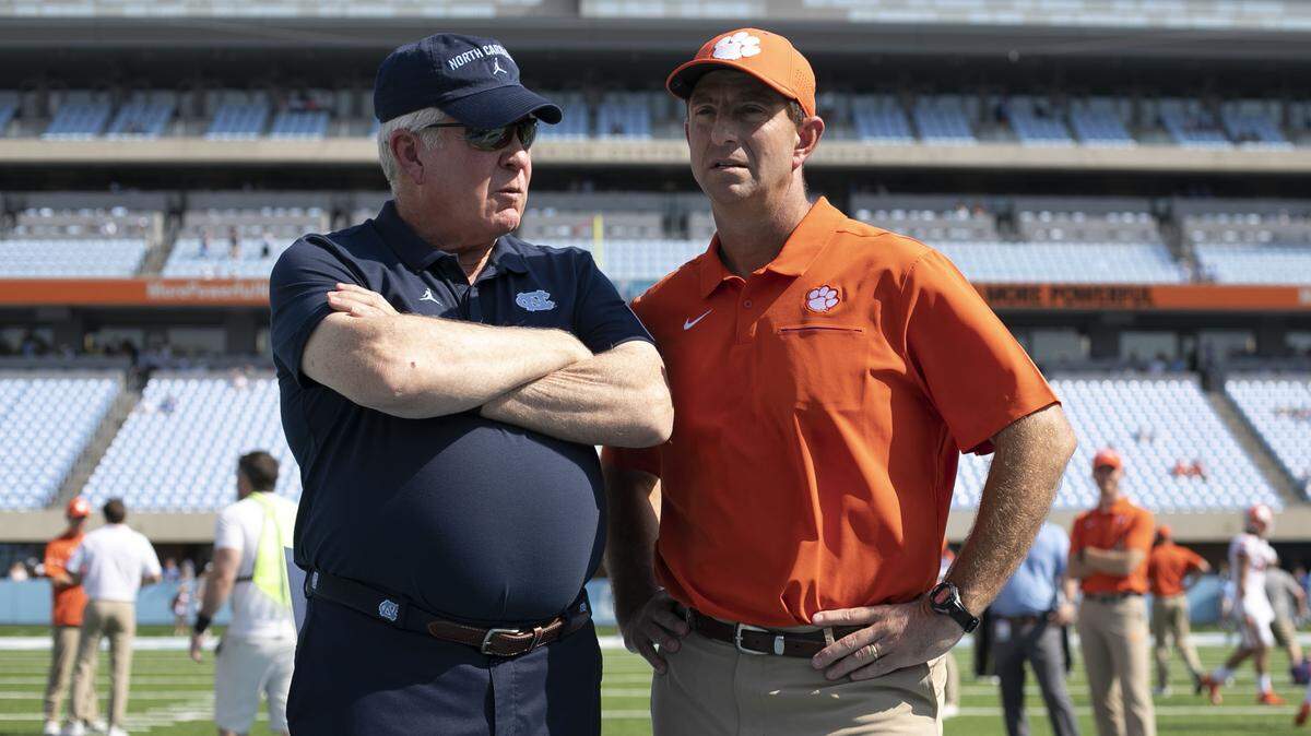 Clemson head coach Dabo Swinney chats with North Carolina coach Mack Brown prior to their game on Saturday, September 28, 2019 at Kenan Stadium in Chapel Hill, N.C.