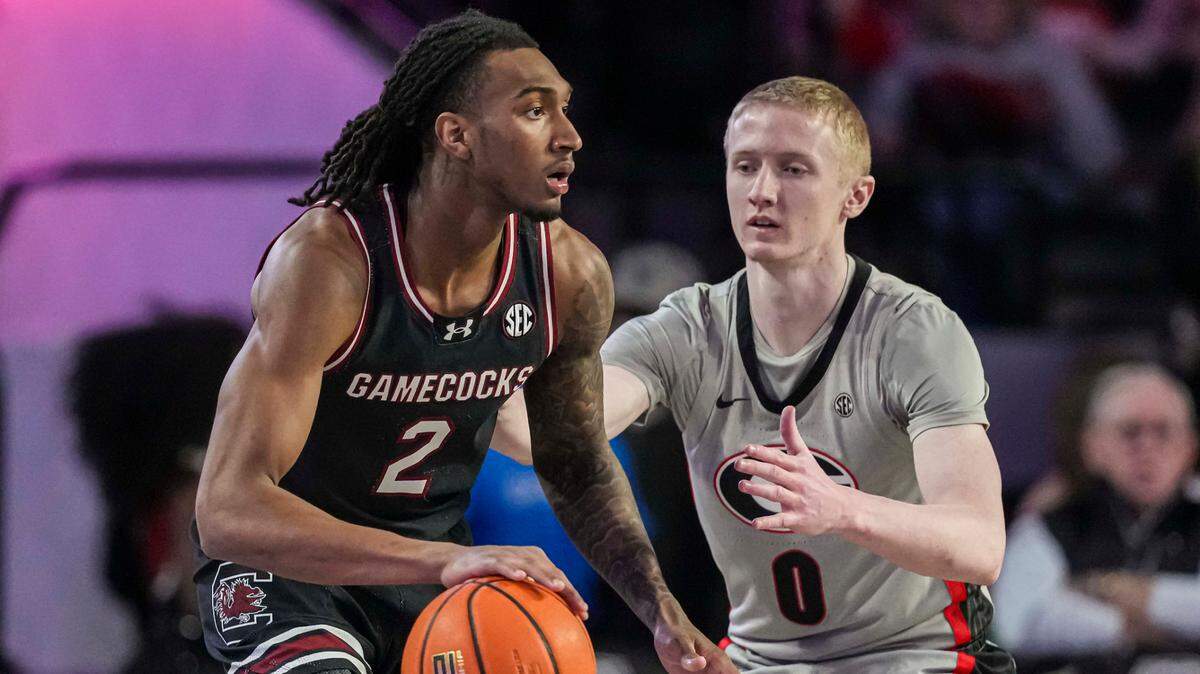 South Carolina Gamecocks guard Zachary Davis (2) dribbles guarded by Georgia Bulldogs guard Blue Cain (0) during the first half at Stegeman Coliseum.