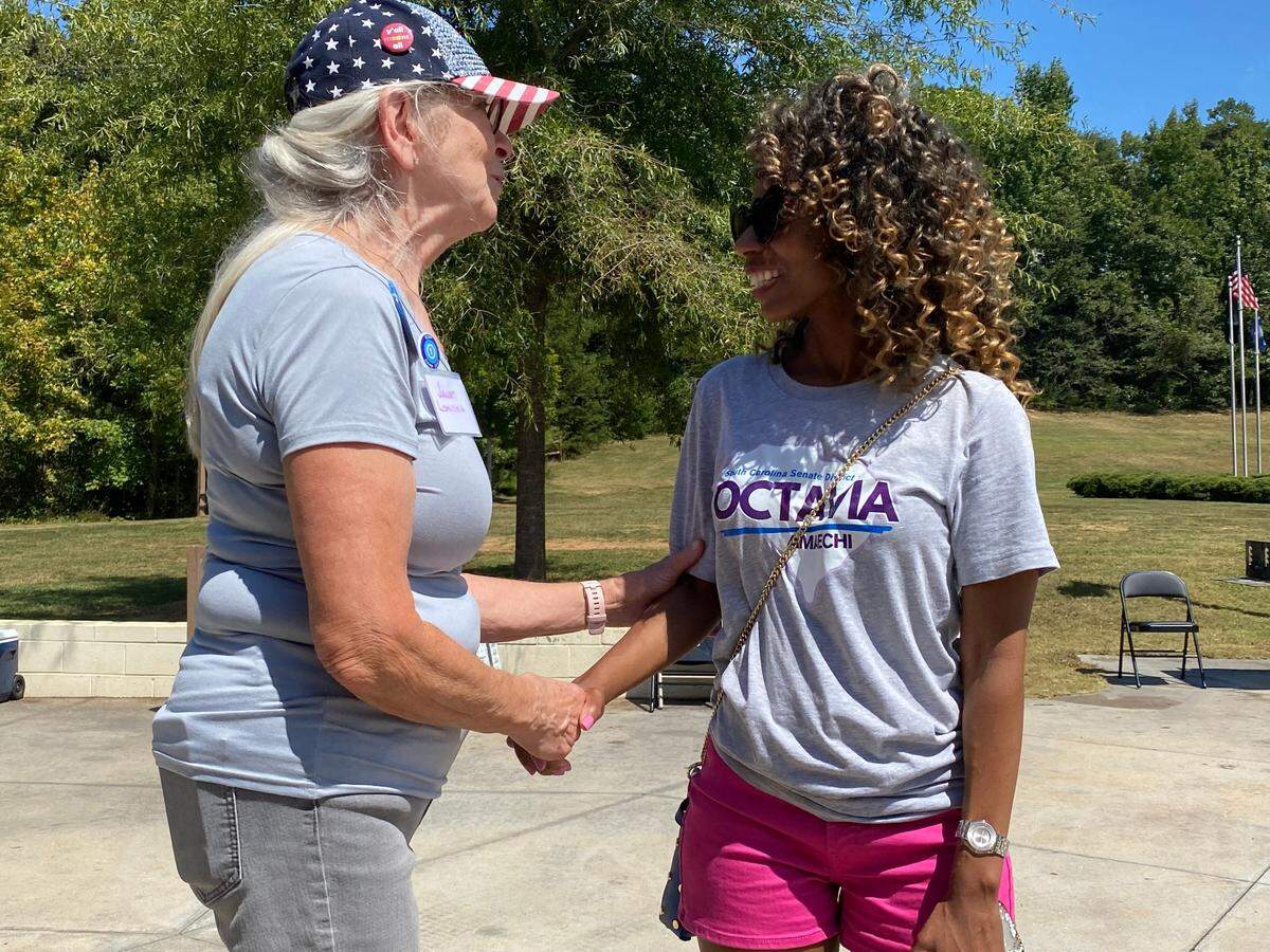 State Senate District 12 Democratic nominee Octavia Amaechi (right) speaks to Janet Lomicka at the Greenville County Candidate Cookout on Saturday, Sept. 7, 2024.