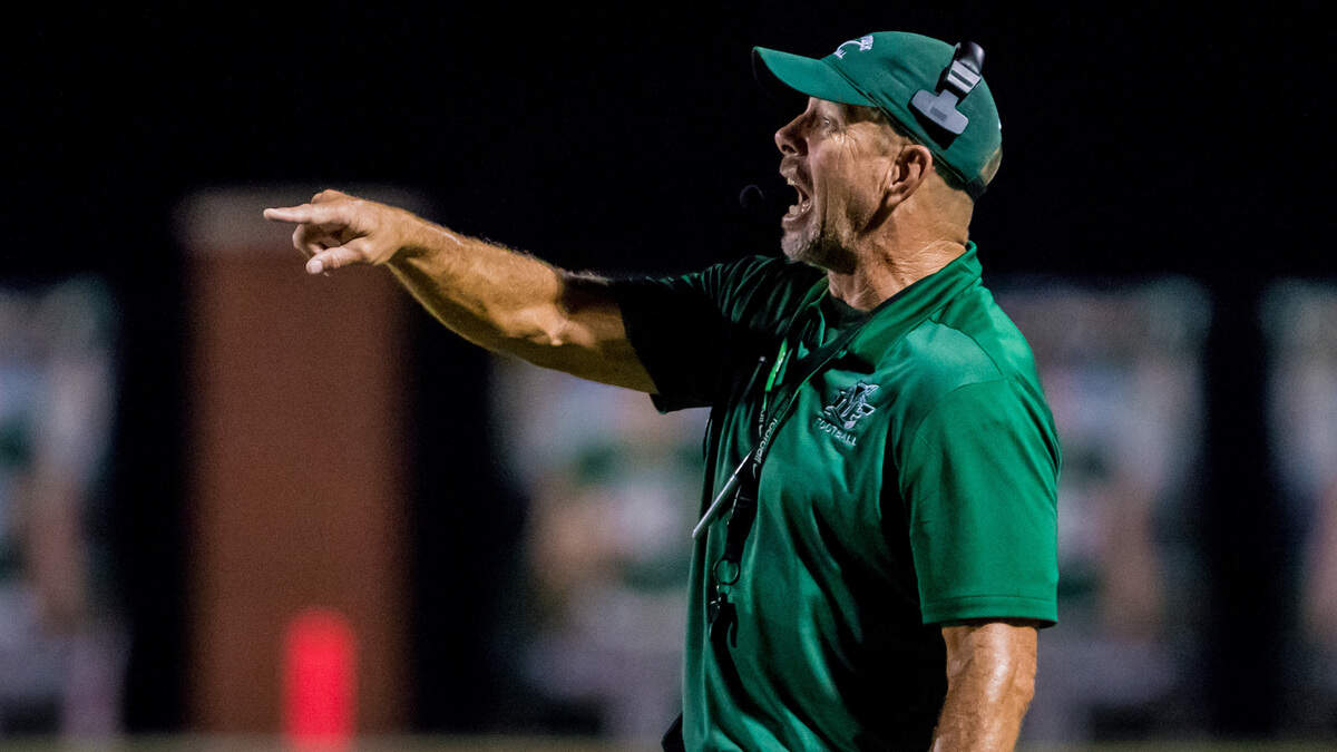 Dutch Fork Silver Foxes head coach Tom Knotts directs his team during the game between Dutch Fork High at River Bluff High School.