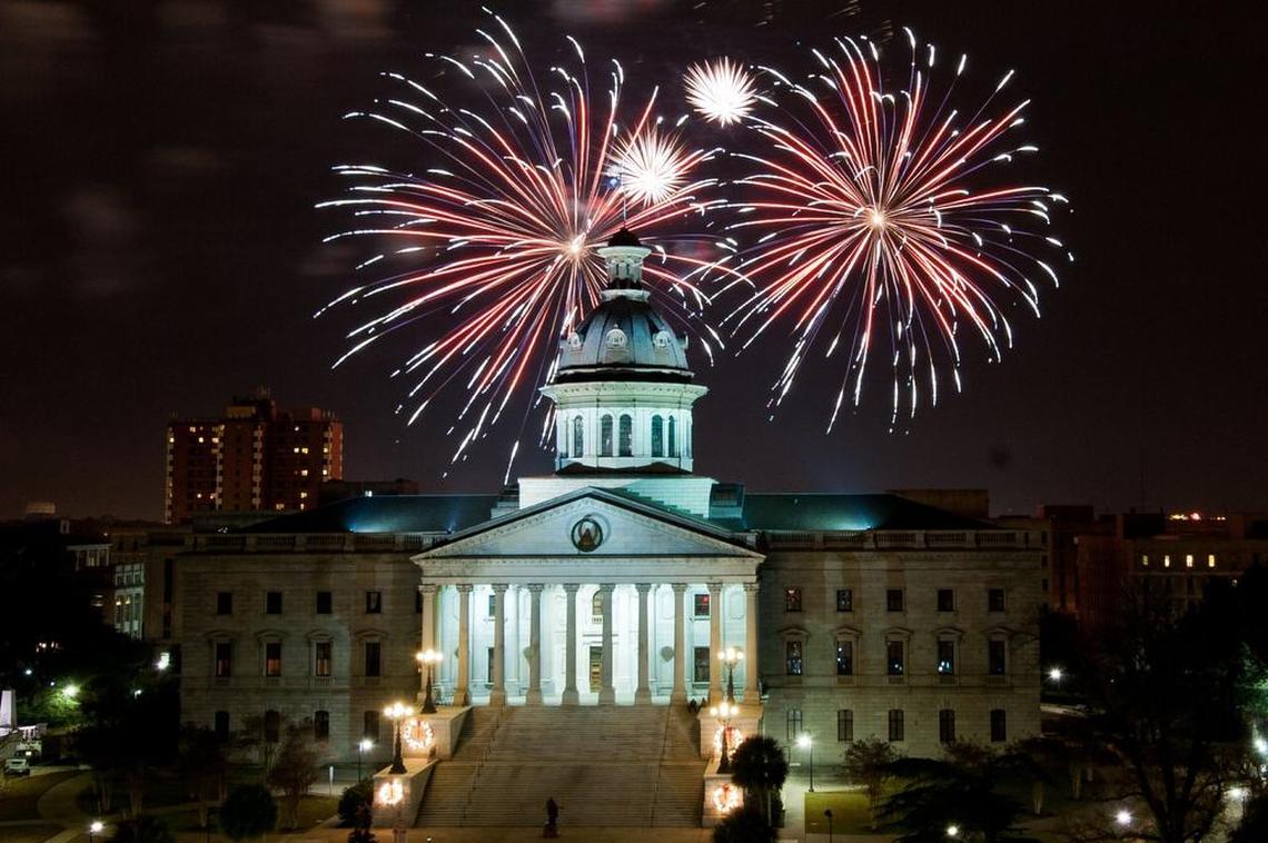 Thousands gather in front of the State House for Famously Hot New Years celebration, topped off with some midnight fireworks to ring in the New Year.