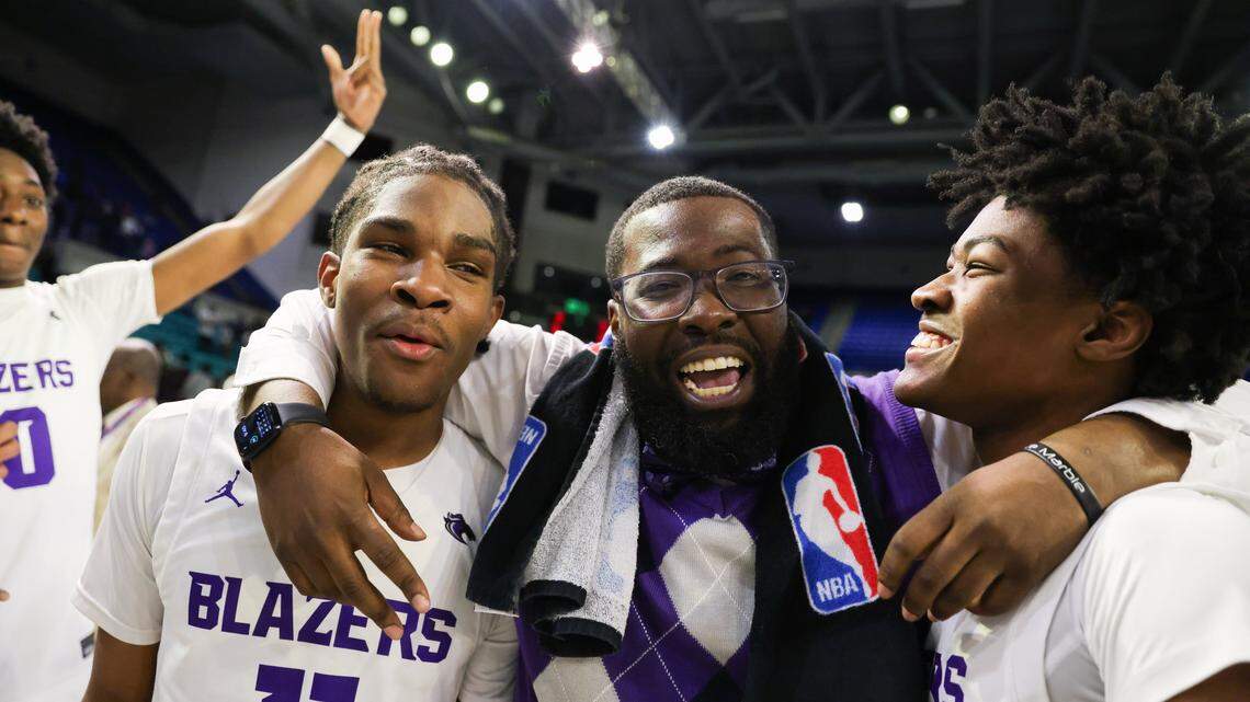 Ridge View assistant coach Christian Savage, middle, celebrates after the Blazers won 2025 Class 5A Division I championship on Friday, March 7, 2025. Savage will be the new basketball coach at Richland Northeast.