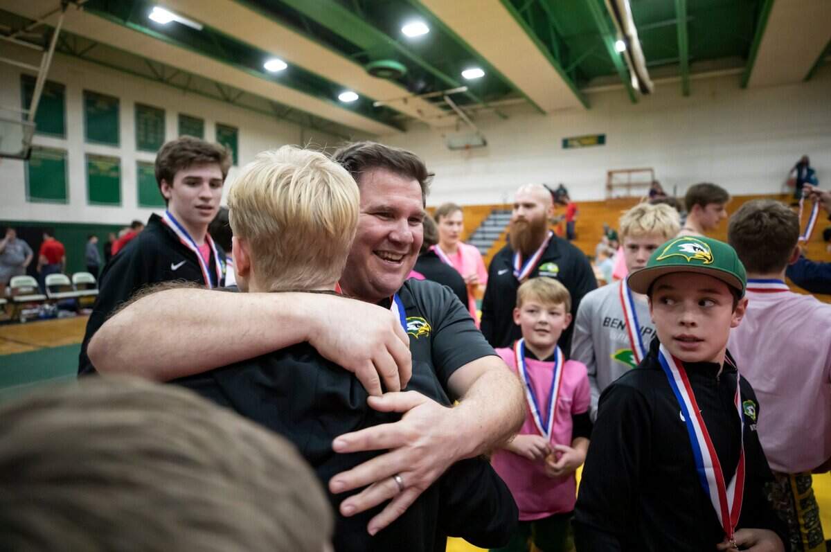 Ben Lippen coach Bert Medlin celebrates with his wrestlers after defeating the Hammond School in the SCISA 2022 Duals State Wrestling Tournament at Ben Lippen on Saturday, February 5, 2022.