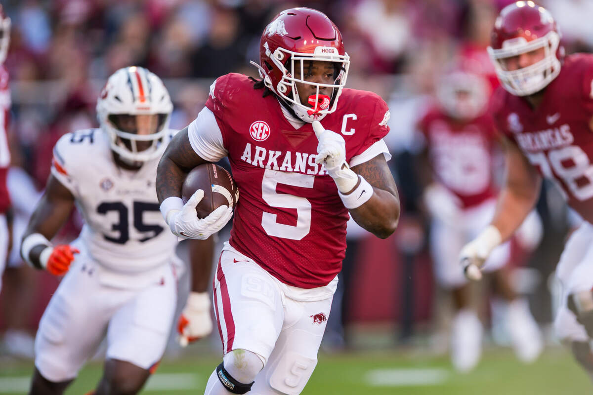 Arkansas Razorbacks running back Raheim “Rocket” Sanders (5) runs the ball during the first quarter against the Auburn Tigers at Donald W. Reynolds Razorback Stadium.