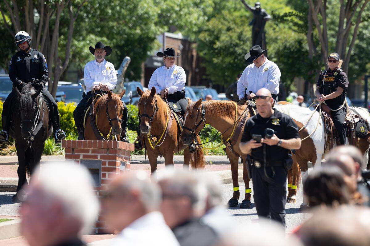 Handlers wait their animals during a ceremonial bill signing of a law increasing penalties for those who harm law enforcement animals at the Columbia Metropolitan Convention Center on Wednesday, June 3, 2026.