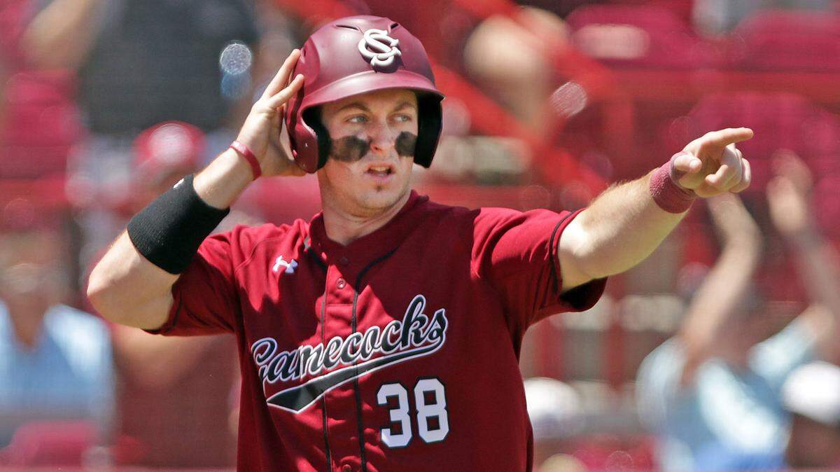 South Carolina catcher Hunter Taylor points to Madison Stokes after Stokes delivered a 2 RBI hit Sunday against Ole Miss.