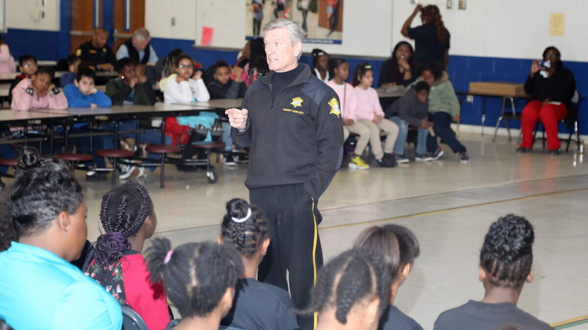Richland County Sheriff Leon Lott speaks with 5th grade graduates of the D.A.R.E. program at Pine Wood Elementary School.