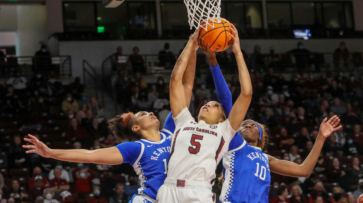 South Carolina’s Victaria Saxton (5) pulls down a rebound as Kentucky’s Treasure Hunt (12) and Rhyne Howard (10) pressure dring the second half of action on Sunday, Jan. 9, 2022 in the Colonial Life Arena.