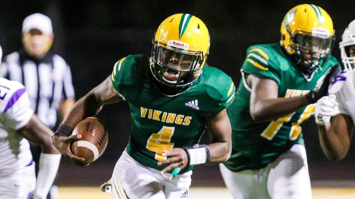 Spring Valley Vikings quarterback DQ Smith (4) scrambles against the Ridge View Blazers.
