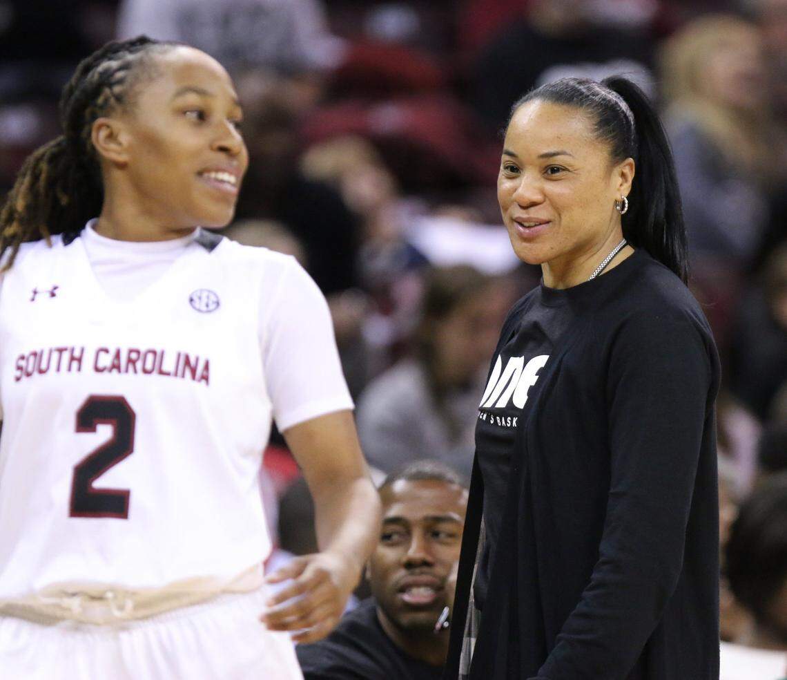 Coach Dawn Staley talks with South Carolina Gamecocks guard Olivia Gaines (2) during the first half of action in an exhibition game against Coker College on Nov. 2, 2014.