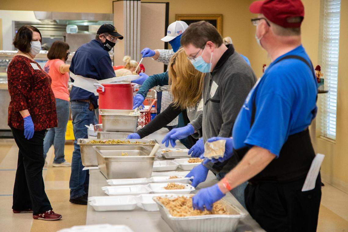 Members of churches across Columbia prepare a Thanksgiving lunch at The Basilica of St. Peter in downtown Columbia, South Carolina on Thursday, November 26, 2020. Over 200 turkeys were donated for this year’s event.