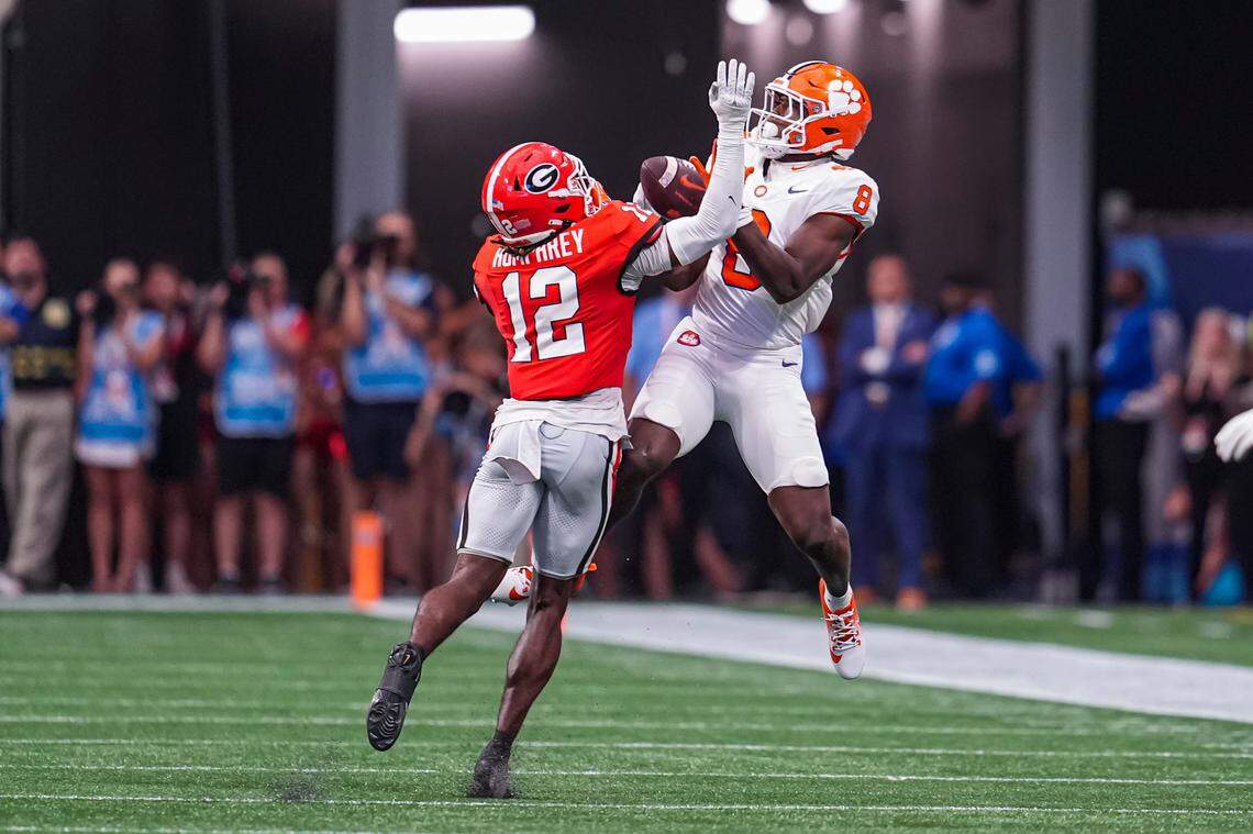 Clemson Tigers wide receiver Adam Randall (8) tries for a catch defended by Georgia Bulldogs defensive back Julian Humphrey (12) during Saturday’s game at Mercedes-Benz Stadium.