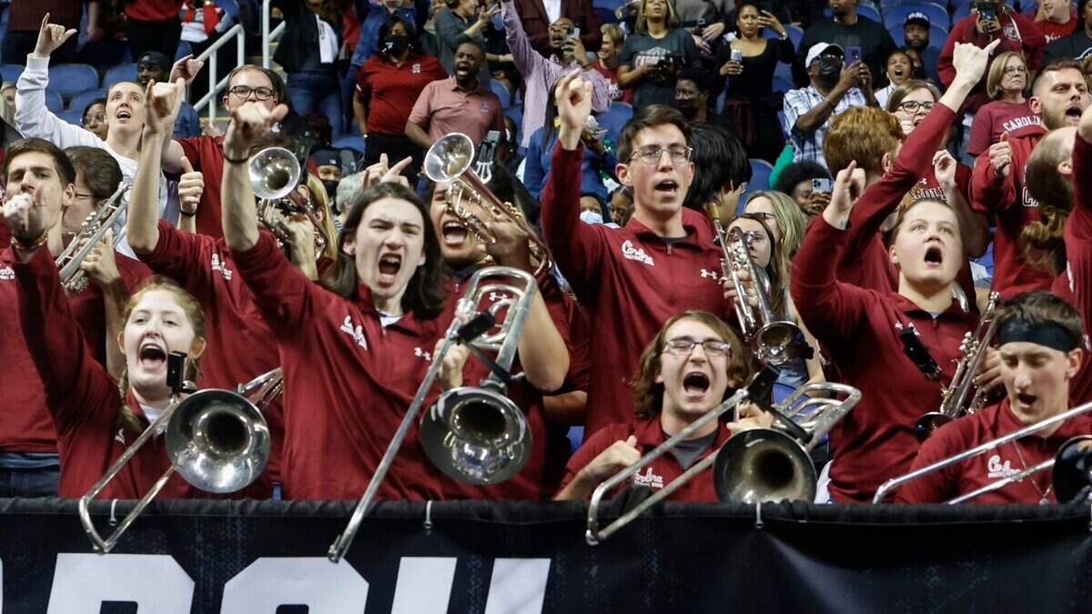 The band and fans celebrate USCswin over the University of North Carolina to advance to the Elite Eight at the Greensboro Coliseum on Friday, March 25, 2022.