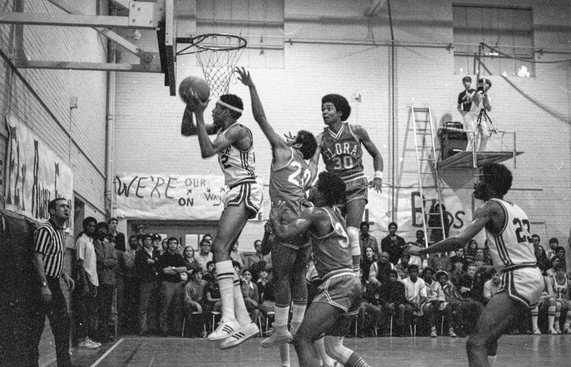 Alex English playing basketball for Dreher High School
