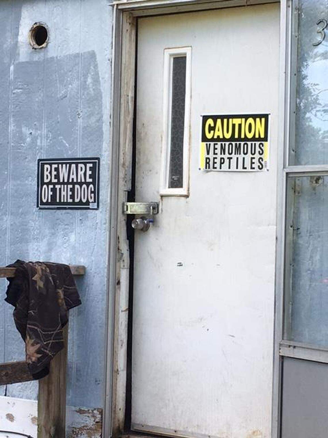 The door to suspected wildlife dealer Freddie Herman's trailer warned of venomous snakes