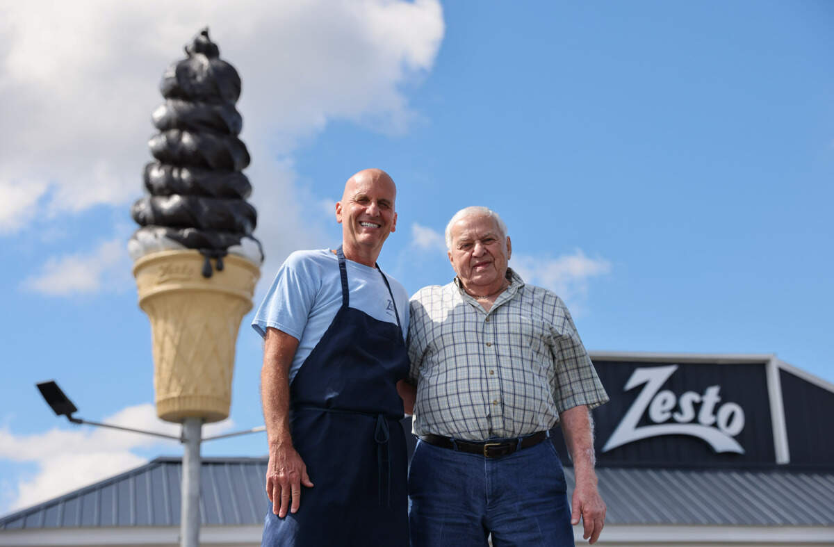 Pete Manos, left, and his father Gus pictured in front of their restaurant, Zesto of West Columbia, on Monday, May 20, 2024.