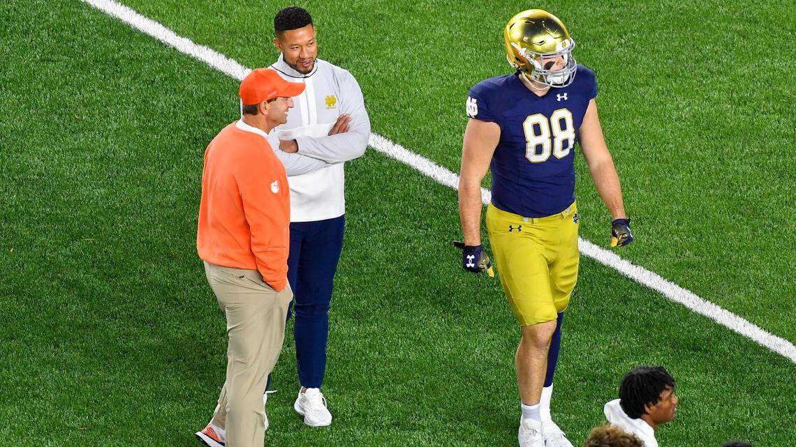Nov 5, 2022; South Bend, Indiana, USA; Clemson Tigers head coach Dabo Swinney and Notre Dame Fighting Irish head coach Marcus Freeman talk before a game at Notre Dame Stadium. Mandatory Credit: Matt Cashore-USA TODAY Sports