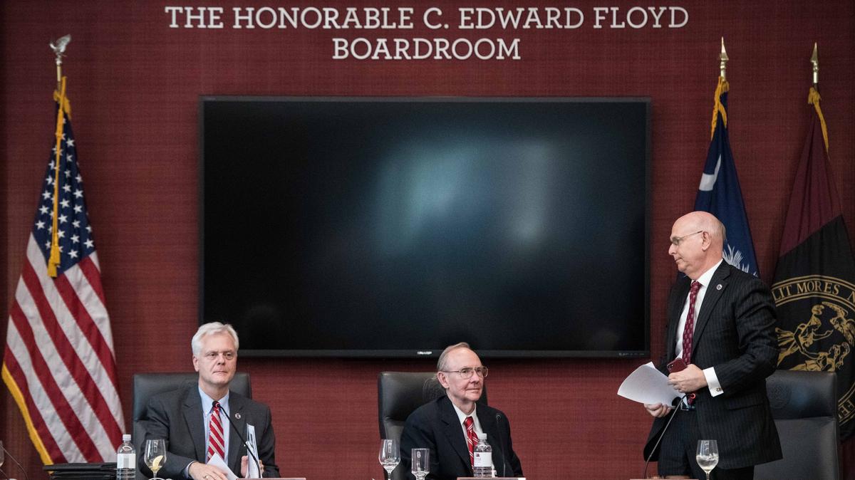 Hubert F. Mobley, vice chairman of the University of South Carolina Board of Trustees, right, with John C. von Lehe, center, and J. Cantey Heath Jr., left, adjourns a meeting after announcing the reopening of the presidential search to replace Harris Pastides at the UofSC Alumnus Center Friday, April. 26, 2019, in Columbia, S.C. An interim president will take up the position in August as the university makes a second attempt to find a suitable replacement.