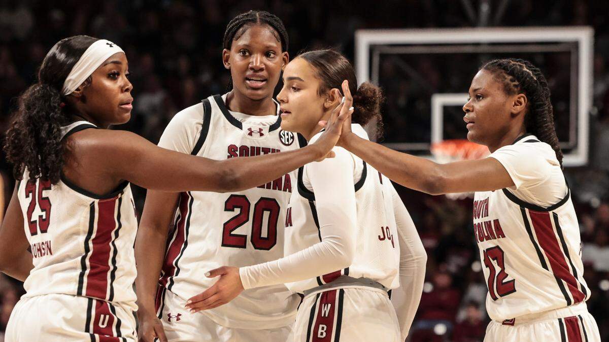 University of South Carolina’s Raven Johnson (25) high five’s MiLaysia Fulwiley (12) during the first half of action in the Colonial Life Arena on Sunday, Jan. 12, 2025.