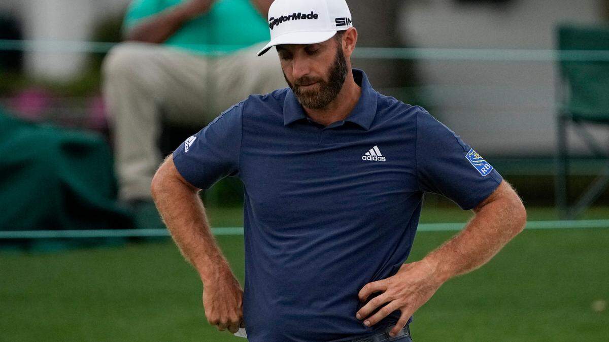 Dustin Johnson looks down after putting on the 18th hole during the second round of the Masters golf tournament on Friday, April 9, 2021, in Augusta, Ga. (AP Photo/Gregory Bull)