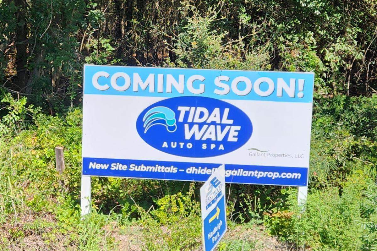 A “coming soon” sign touts a Tidal Wave Auto Spa in the 2300 block of Augusta Highway in Lexington, just east of Lexington High School.