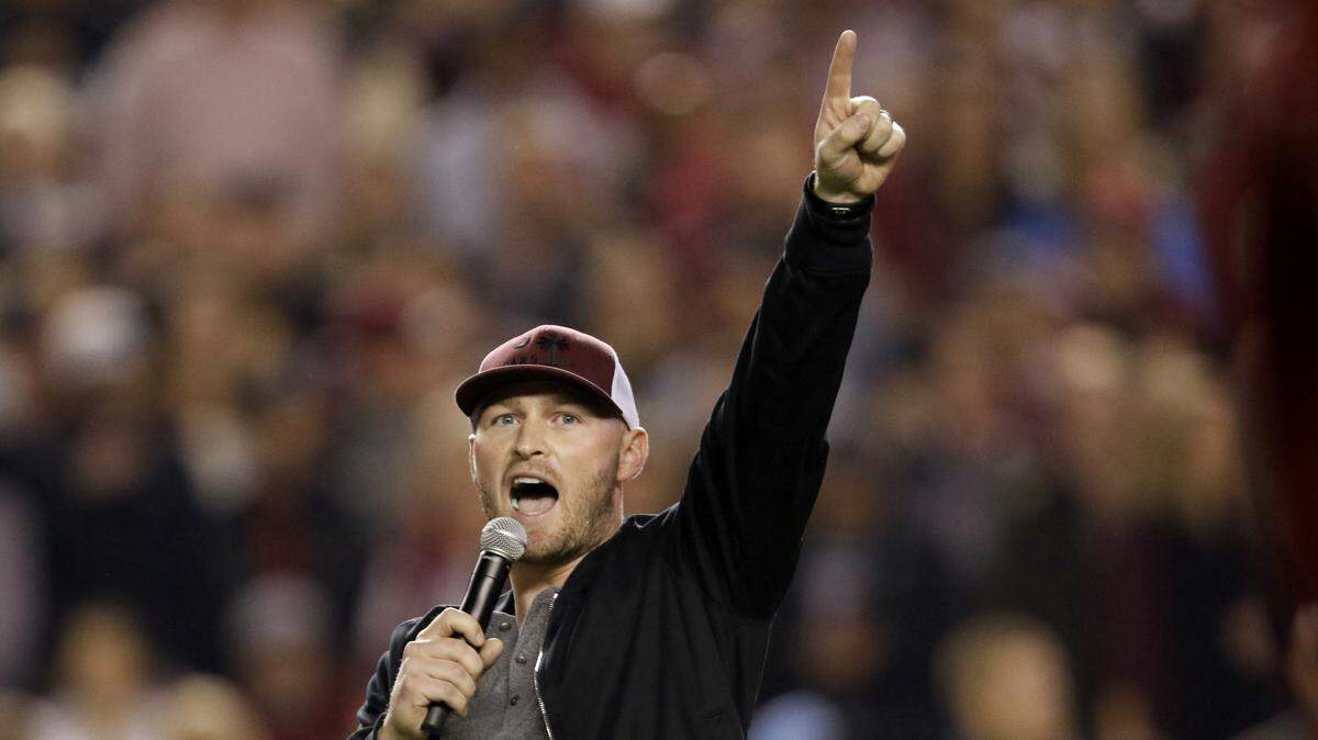 Former South Carolina quarterback Connor Shaw leads the crowd in a chant before the first half against Clemson at Williams-Brice Stadium, Saturday, November 25, 2017.