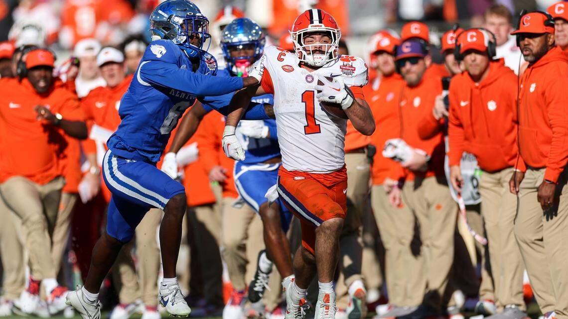 Clemson Tigers running back Will Shipley (1) is forced out of bounds by Kentucky Wildcats defensive back Jonquis Hardaway (6) in the fourth quarter during the Gator Bowl at EverBank Stadium.