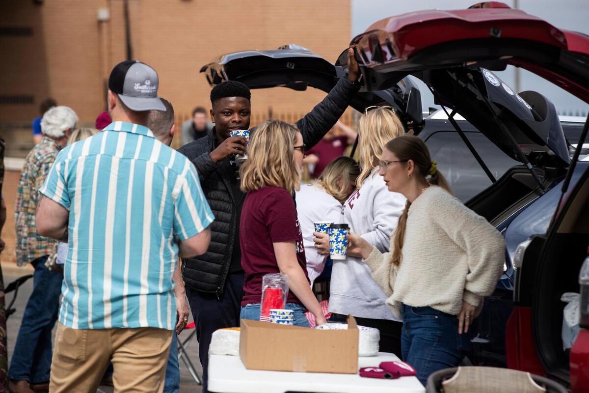 Fans tailgate before Erskine College plays Shorter University on Saturday, March 13, 2021.