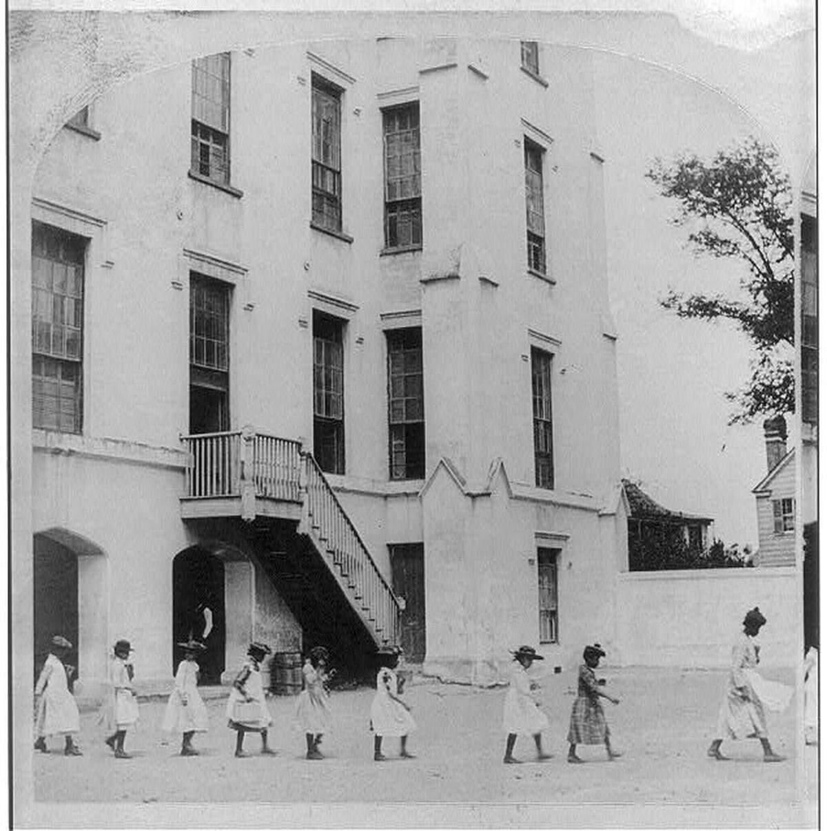 Photograph of students following a teacher in the schoolyard at Simonton School, B.W. Kilburn, circa 1891, courtesy of Library of Congress.