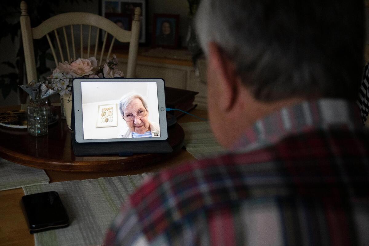Nora Schafer speaks with her husband Ulrich Schafer over FaceTime video chat in Lexington, South Carolina on Thursday, February 4, 2021.