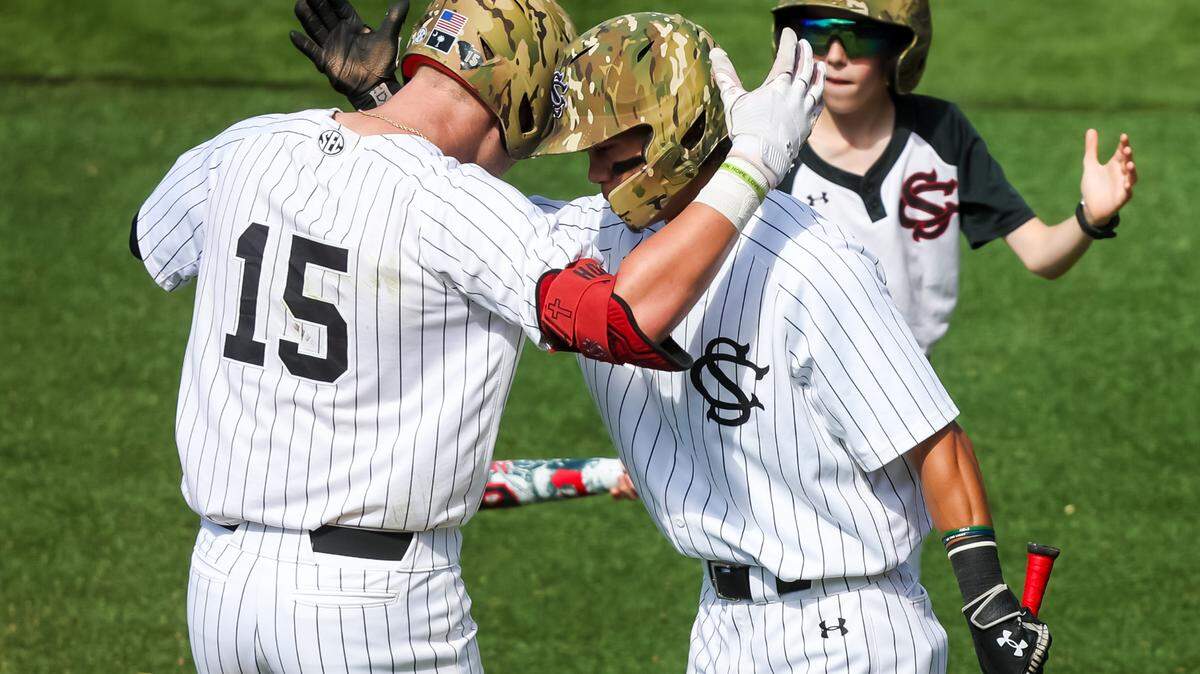 South Carolina Gamecocks 1B Beau Hollins (15) and 2B Jordan Carrion (24) celebrate a Hollins home run against the LSU Tigers during their game at Founders Park on Saturday, May 17, 2025.