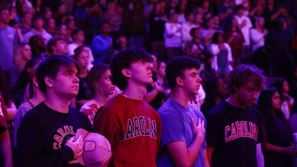 South Carolina fans observe the National Anthem before their team plays SC State at Colonial Life Arena on Friday, November 8, 2024.