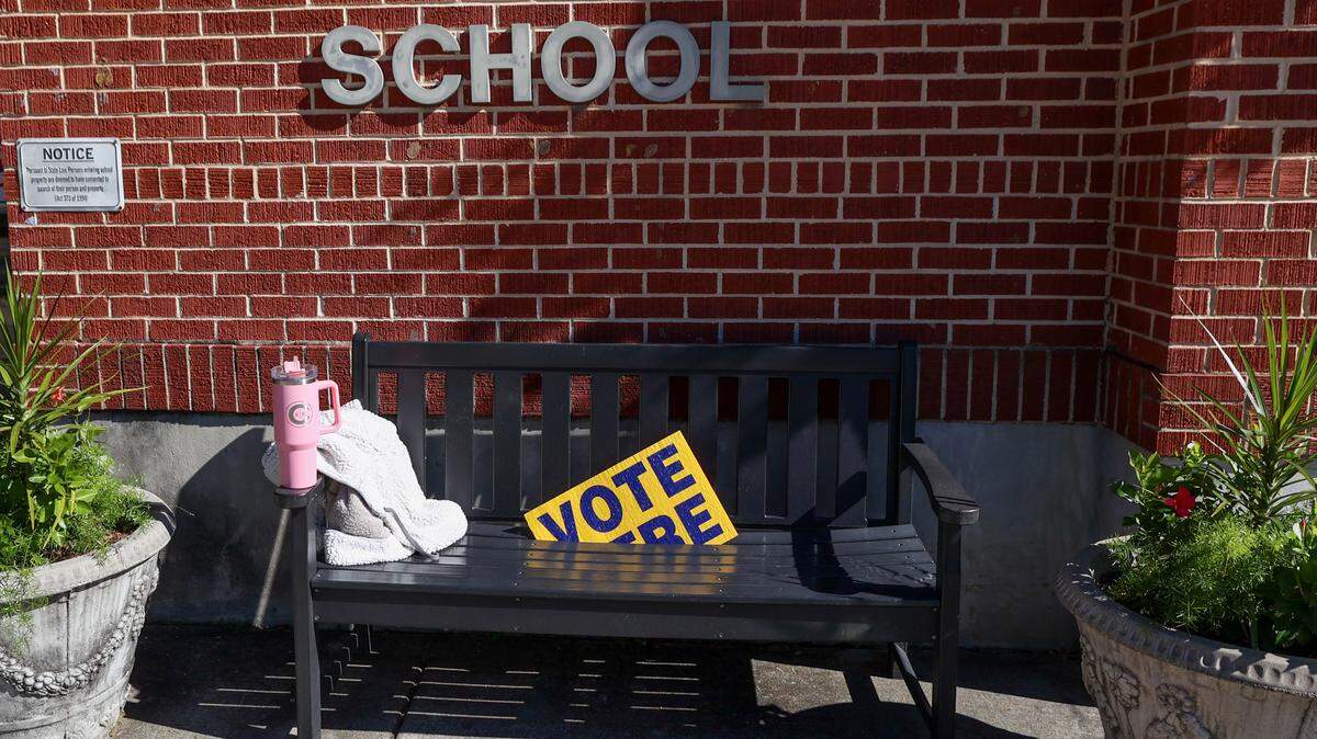 Directional signs are posted outside Hand Middle School for the municipal election Tuesday, Nov. 4, 2025.