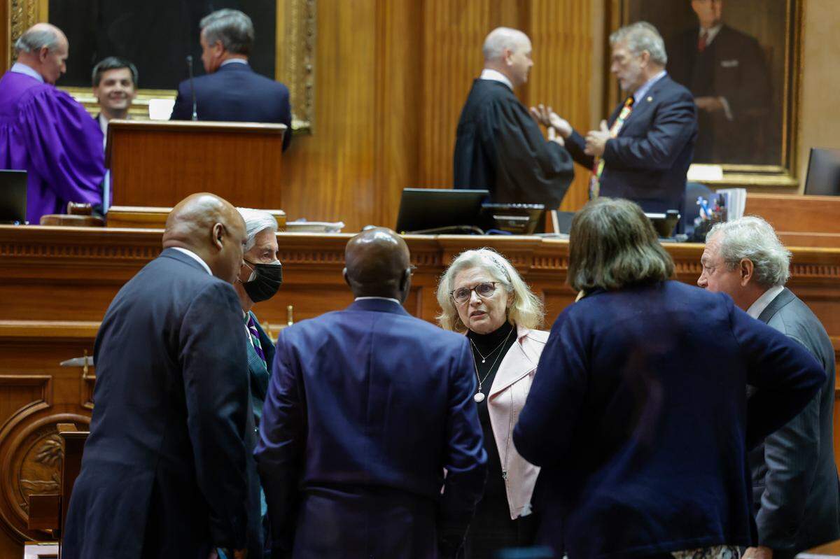 Senators confer during a break while debating amendments about the ban on abortion in the South Carolina Senate chamber on Thursday Sept. 08, 2022.