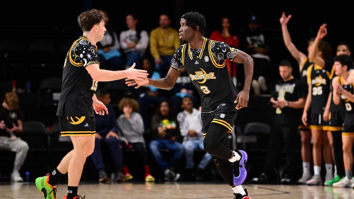 Eli Ellis, left, of the YNG Dreamerz and Abu Yarmah of the YNG Dreamerz high five during an OTE League game on Saturday, December 7, 2024 at OTE Arena in Atlanta, Georgia.