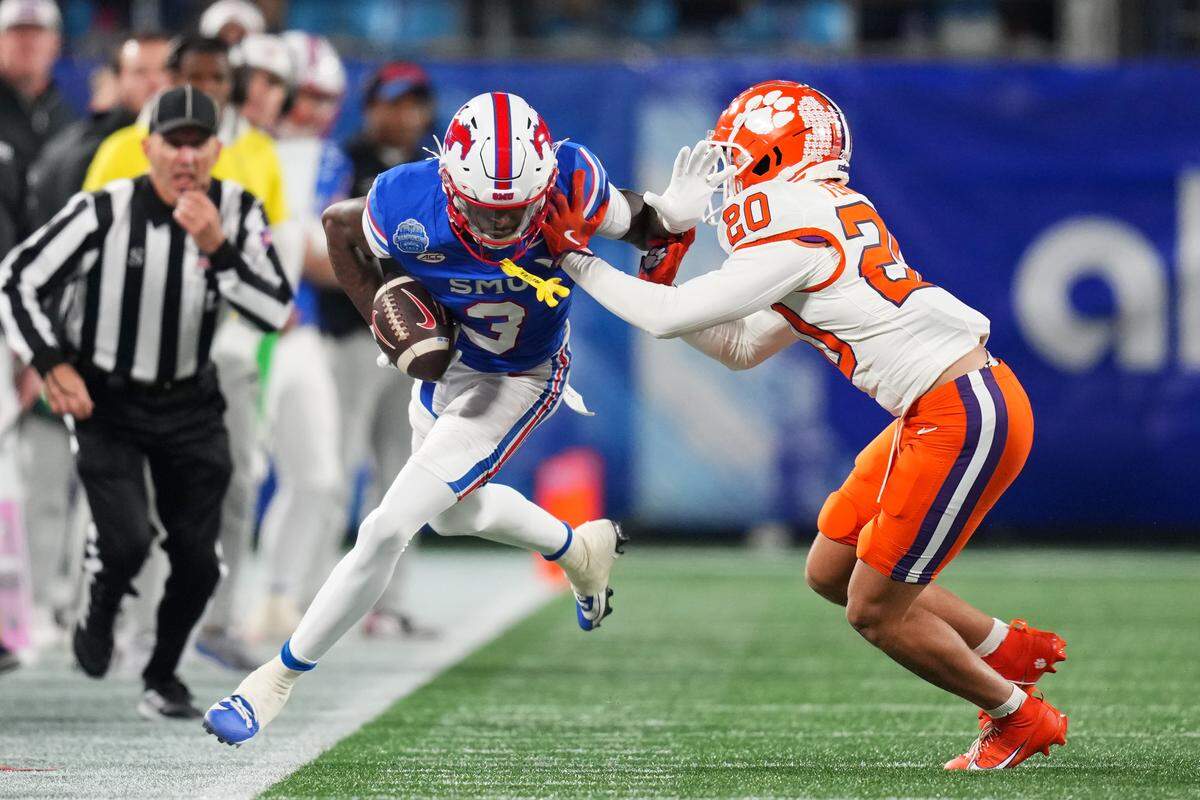 Avieon Terrell #20 of the Clemson Tigers forces Romello Brinson #3 of the SMU Mustangs during the second quarter of the 2024 ACC Football Championship at Bank of America Stadium on Dec. 7, 2024 in Charlotte, North Carolina.