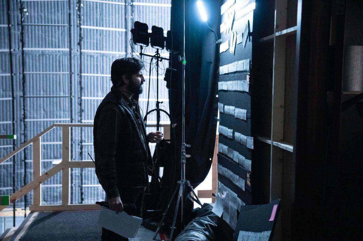 Assistant director Ed Tilden reviews storyboards for a day’s work on “Superman” in a soundstage in Atlanta.