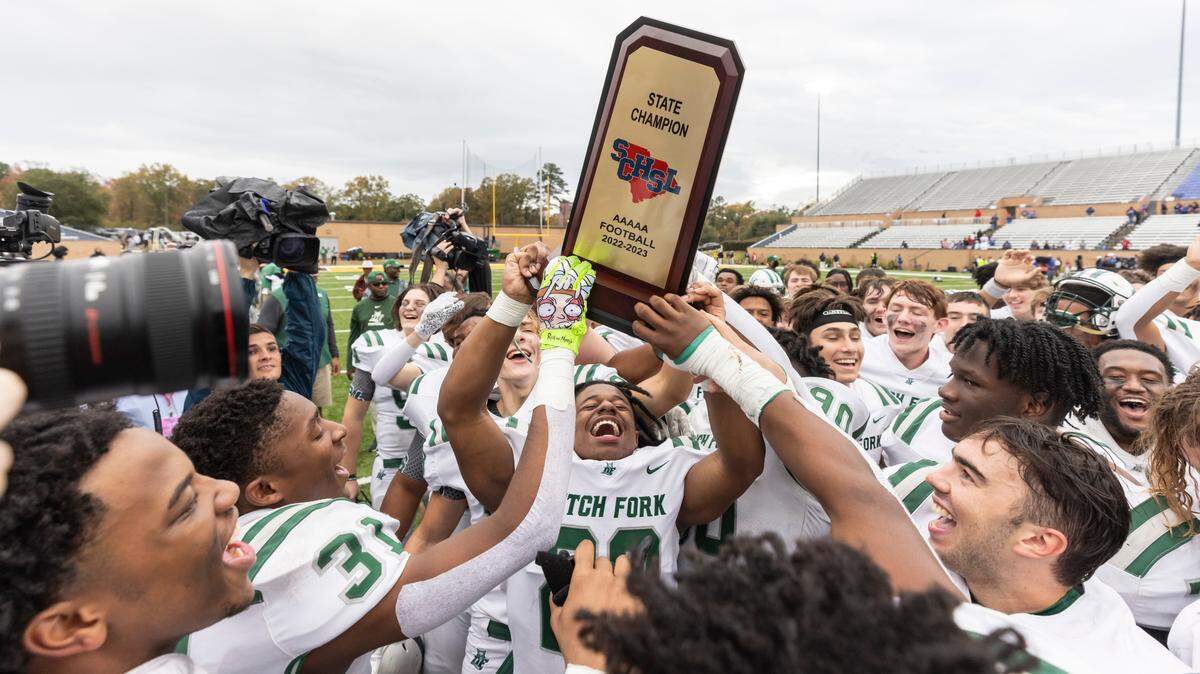 Chandler Perry of Dutch Fork celebrates with teammates following their win over Fort Dorchester in the SCHSL Class 5A Football State Championship at Charles W.Johnson Stadium in Columbia, SC on Saturday, Dec. 3, 2022.