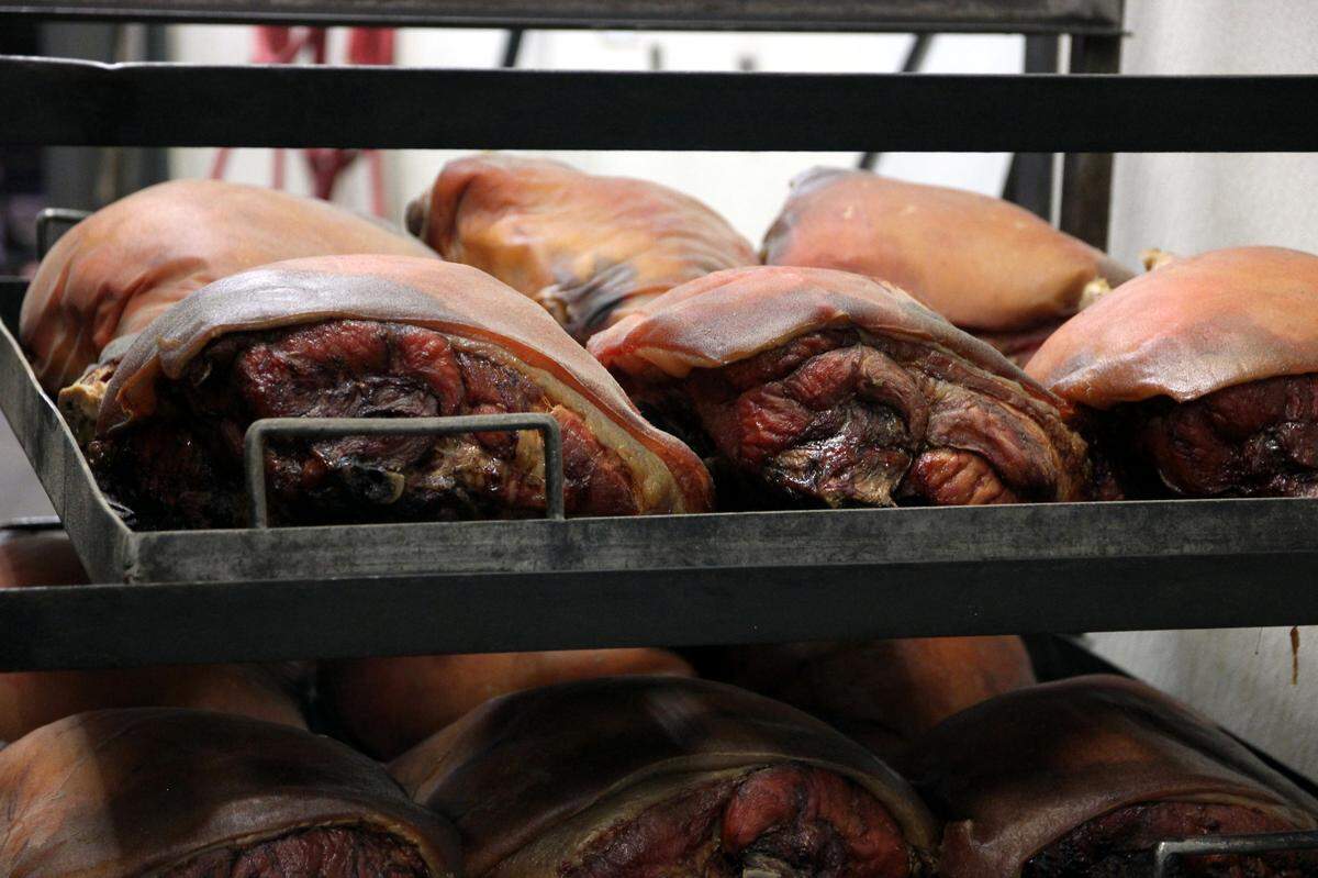 A rack of pork shoulders has come out of the pits at Maurice’s Piggie Park BBQ. Oct. 11, 2023