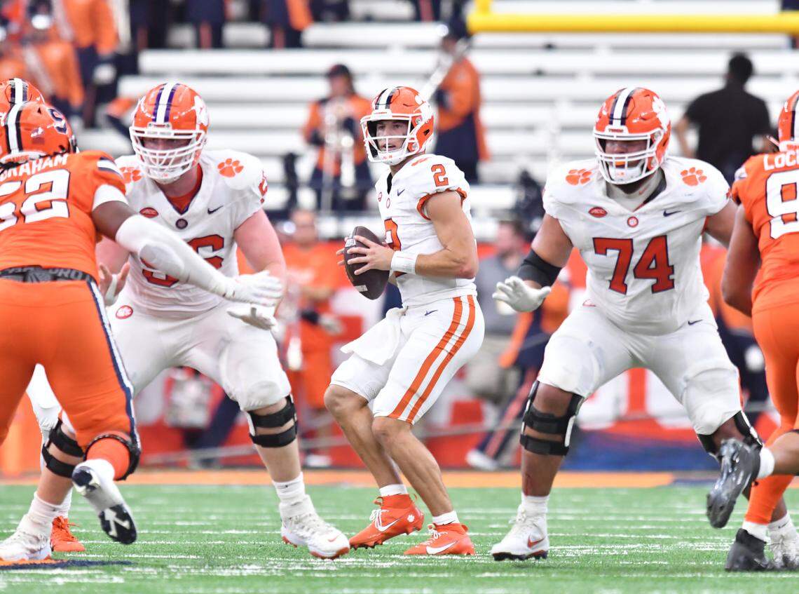 Sep 30, 2023; Syracuse, New York, USA; Clemson Tigers quarterback Cade Klubnik (2) looks to throw a pass as Clemson Tigers offensive linemen Will Putnam (56) and Marcus Tate (74) block against the Syracuse Orange in the second quarter against the Syracuse Orange at the JMA Wireless Dome.