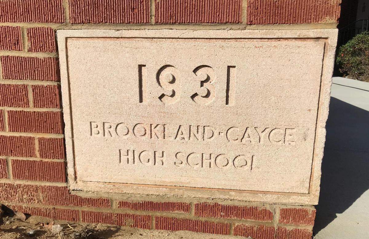The mysterious box was discovered behind this brick at Brookland-Cayce High School.