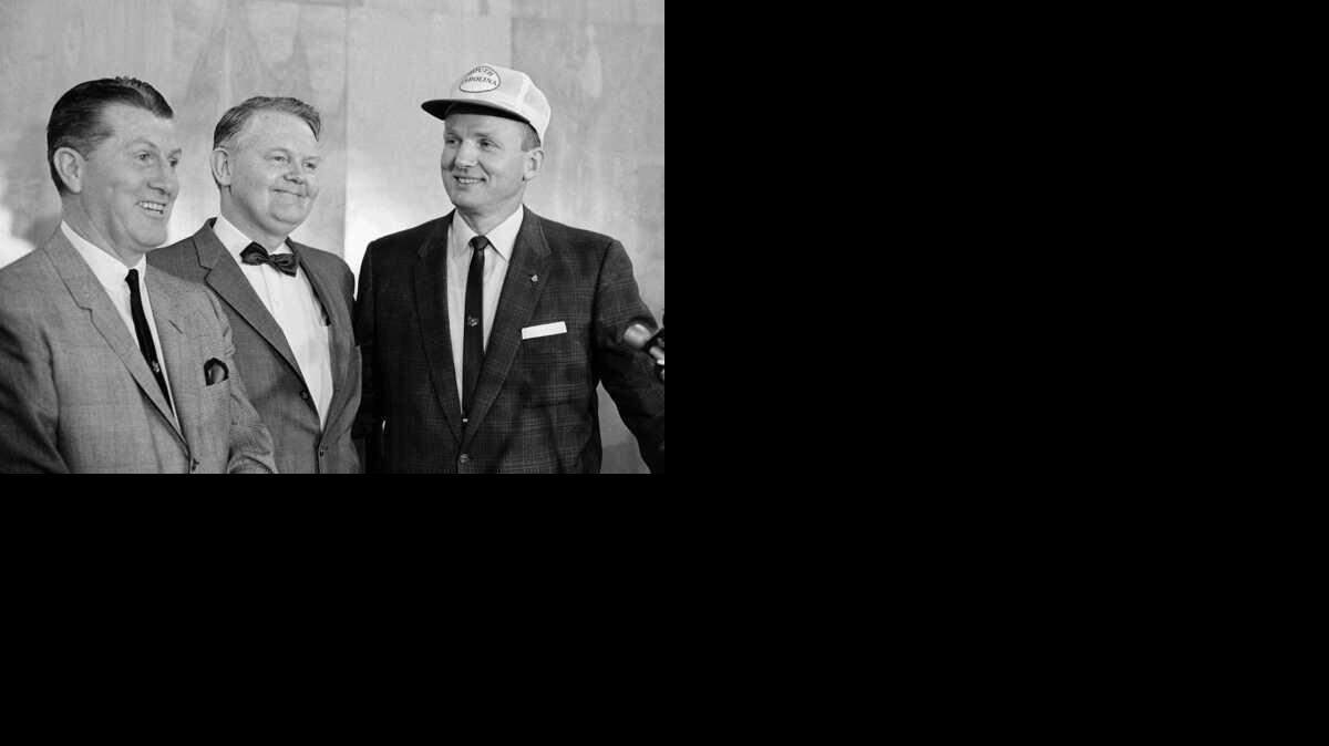 South Carolina's head football coach Paul Dietzel, right, shown April 1966 in Columbia, S.C., with Frank McGuire and president Thomas Jones.